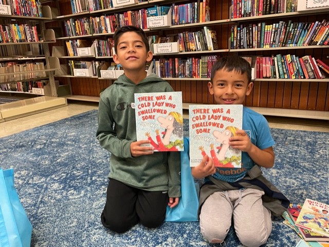 Two little boys with books